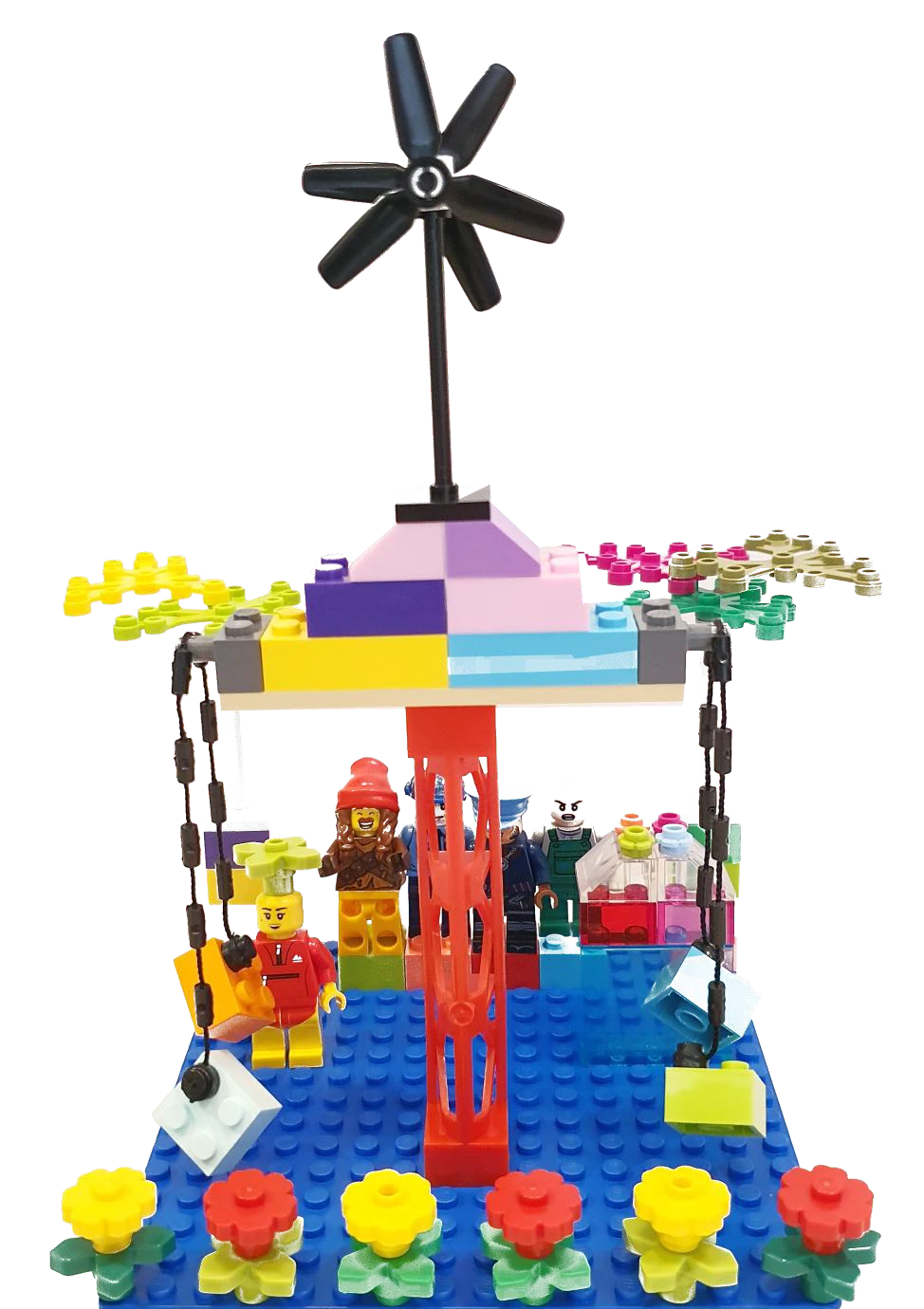 Hand holding a colorful LEGO block creation